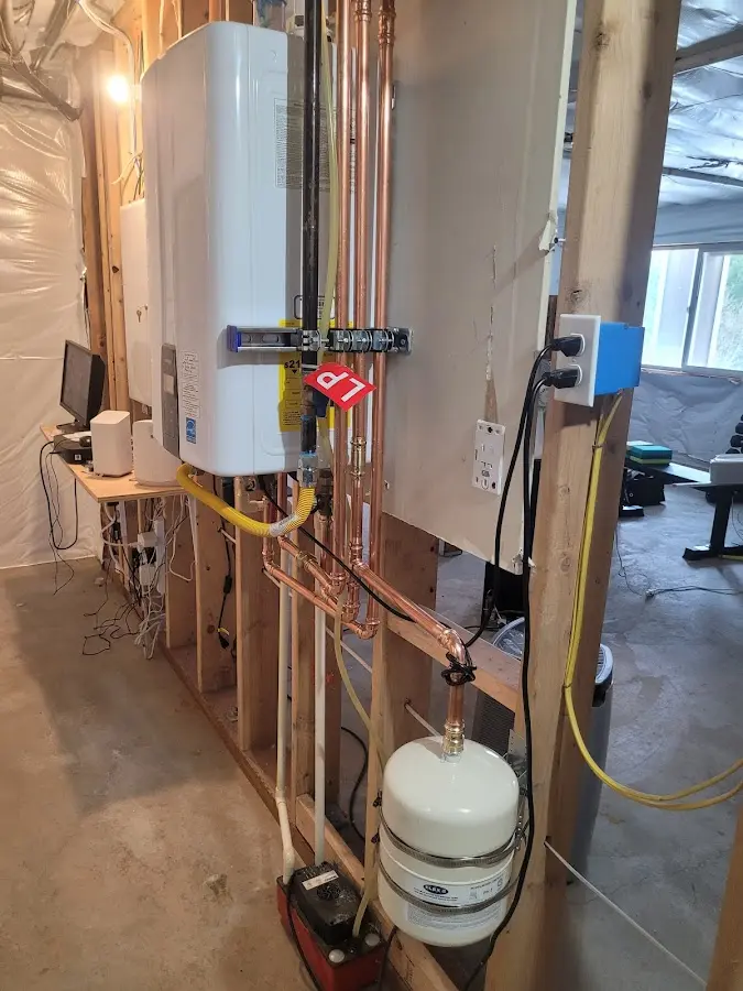 Licensed plumber repairing a kitchen sink in McCall